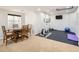 Finished basement recreation room includes a table, workout equipment, and TV at 10726 Amesbury Way, Highlands Ranch, CO 80126