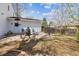 Backyard patio featuring a fire pit and outdoor seating for entertaining Gathering and friends at 3756 S Chase St, Denver, CO 80235