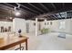 Spacious basement featuring multiple living areas and ample space for activities at 3756 S Chase St, Denver, CO 80235