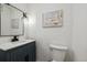 Stylish half bathroom with modern sink, vanity, and elegant decor at 3756 S Chase St, Denver, CO 80235