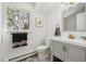 Updated bathroom featuring a grey vanity, new fixtures, and patterned tile floor at 3756 S Chase St, Denver, CO 80235