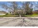 Charming two-story home with mature trees and well-manicured front yard, perfect curb appeal at 3756 S Chase St, Denver, CO 80235
