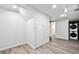 Bright basement area with updated floors and convenient laundry area at 2835 N Monaco Pkwy, Denver, CO 80207