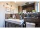 Modern bathroom with stylish vanity, slate-tile shower, and contemporary fixtures at 2835 N Monaco Pkwy, Denver, CO 80207