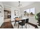 Well-lit dining room with stylish table set and decor, adjacent to the modern kitchen at 2835 N Monaco Pkwy, Denver, CO 80207