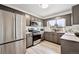 Modern kitchen with stainless steel appliances and ample counter space at 2835 N Monaco Pkwy, Denver, CO 80207