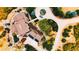 Aerial view of the home showcasing its circular driveway and lush surroundings at 2916 Hiwall Ct, Castle Rock, CO 80109