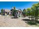 Backyard with a playground, mature trees, and a well-maintained lawn at 2916 Hiwall Ct, Castle Rock, CO 80109