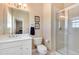 Bathroom with a white vanity, frameless glass shower and neutral color scheme at 2916 Hiwall Ct, Castle Rock, CO 80109