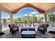 Inviting covered deck with comfortable seating and scenic views at 2916 Hiwall Ct, Castle Rock, CO 80109
