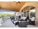 Expansive covered deck with multiple seating areas, perfect for outdoor entertaining at 2916 Hiwall Ct, Castle Rock, CO 80109