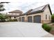 Home exterior showing a four-car garage with solar panels and a concrete driveway at 2916 Hiwall Ct, Castle Rock, CO 80109