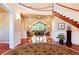 Spacious foyer showcasing a grand staircase, hardwood floors, and views to the living room at 2916 Hiwall Ct, Castle Rock, CO 80109