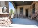 Charming front porch with stone accents, outdoor seating, and a decorative owl statue at 2916 Hiwall Ct, Castle Rock, CO 80109