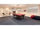 Spacious game room with a pool table and seating, ideal for entertainment and relaxation at 2916 Hiwall Ct, Castle Rock, CO 80109