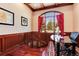 Inviting home office with natural light, wood trim, and a view of trees in the landscape at 2916 Hiwall Ct, Castle Rock, CO 80109