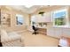Bright studio with built-in cabinets, counter space, and natural light for creative projects at 2916 Hiwall Ct, Castle Rock, CO 80109