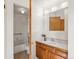 A bathroom showcasing a shower-tub combination, a sink vanity, and neutral-colored tiles at 277 S Taft Ct # 54, Louisville, CO 80027