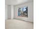 Bright bedroom features neutral carpeting and a large window with neighborhood views at 277 S Taft Ct # 54, Louisville, CO 80027