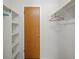 An organized walk-in closet with shelving and hanging rods provides ample storage space at 277 S Taft Ct # 54, Louisville, CO 80027