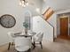 Bright dining room with ceiling fan, large clock, and a view from a window, creating a pleasant atmosphere at 277 S Taft Ct # 54, Louisville, CO 80027