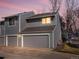 Charming two-story home featuring a two-car garage, gray siding, and well-maintained landscaping at 277 S Taft Ct # 54, Louisville, CO 80027