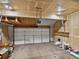 Spacious unfinished garage with overhead lighting and door that opens to the driveway at 277 S Taft Ct # 54, Louisville, CO 80027
