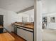 Clean kitchen area featuring wooden countertops, modern appliances, and an open living area at 277 S Taft Ct # 54, Louisville, CO 80027