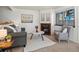 Bright living room featuring comfortable seating and a brick fireplace, creating a relaxing space at 277 S Taft Ct # 54, Louisville, CO 80027
