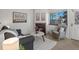 Inviting living room featuring a brick fireplace, modern furniture, and natural light at 277 S Taft Ct # 54, Louisville, CO 80027