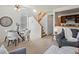 Inviting living and dining area with modern décor, stairs, and a ceiling fan at 277 S Taft Ct # 54, Louisville, CO 80027