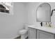 Well-lit bathroom with a modern vanity, sink, and mirror at 1409 Carlyle Park Cir, Highlands Ranch, CO 80129
