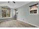 Spacious bedroom has multiple windows for natural light and wood-look floors at 1409 Carlyle Park Cir, Highlands Ranch, CO 80129