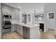 Bright kitchen featuring stainless steel appliances, modern fixtures and a sleek island at 1409 Carlyle Park Cir, Highlands Ranch, CO 80129