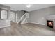 Spacious living room with fireplace and staircase at 1409 Carlyle Park Cir, Highlands Ranch, CO 80129
