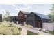 Modern home exteriors featuring unique designs, natural landscaping, and pedestrian-friendly walkways at 733 Turner St, Erie, CO 80516