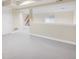 Spacious basement area with neutral carpet and ample potential for customization at 6274 S Iola Ct, Englewood, CO 80111