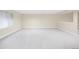 Large basement with carpet and a window, perfect for recreation or storage at 6274 S Iola Ct, Englewood, CO 80111