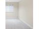 This bedroom features neutral walls, plush carpeting and a window with white blinds at 6274 S Iola Ct, Englewood, CO 80111