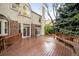 Spacious outdoor deck with beautiful wood and access to the home's interior at 6274 S Iola Ct, Englewood, CO 80111