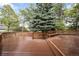 A spacious wooden deck surrounds a home, creating a serene retreat at 6274 S Iola Ct, Englewood, CO 80111