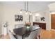 Elegant dining room with modern light fixture, stylish decor, and warm ambiance for gatherings at 6274 S Iola Ct, Englewood, CO 80111