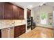 Gourmet kitchen with custom cabinetry, granite countertops, and stainless steel appliances at 6274 S Iola Ct, Englewood, CO 80111