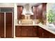 Well-appointed kitchen with granite countertops, stainless steel appliances, and ample cabinet space for storage at 6274 S Iola Ct, Englewood, CO 80111