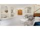 Bright living room with cozy seating and eye-catching decorative shelves at 6274 S Iola Ct, Englewood, CO 80111