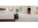 Spacious main bedroom with a cozy fireplace, natural light, and a tranquil atmosphere, ideal for relaxation at 6274 S Iola Ct, Englewood, CO 80111
