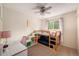Bright bedroom featuring a bunk bed, desk, and ample natural light at 3756 S Mission Pkwy, Aurora, CO 80013