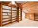 Bonus room featuring built in shelves, cabinets and bench with wood paneled ceiling and skylight at 3756 S Mission Pkwy, Aurora, CO 80013