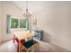 Cozy dining room featuring a vaulted ceiling and a large window for natural light at 3756 S Mission Pkwy, Aurora, CO 80013