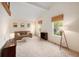 Spacious living room with large windows, neutral carpet, and comfortable seating area at 3756 S Mission Pkwy, Aurora, CO 80013